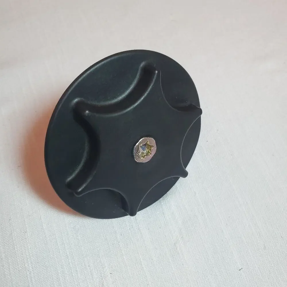 Genuine Nissan Spare Tire Clamp, specifically part number 74810-JY01B